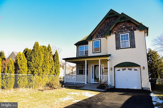 view of front facade with a porch and a garage