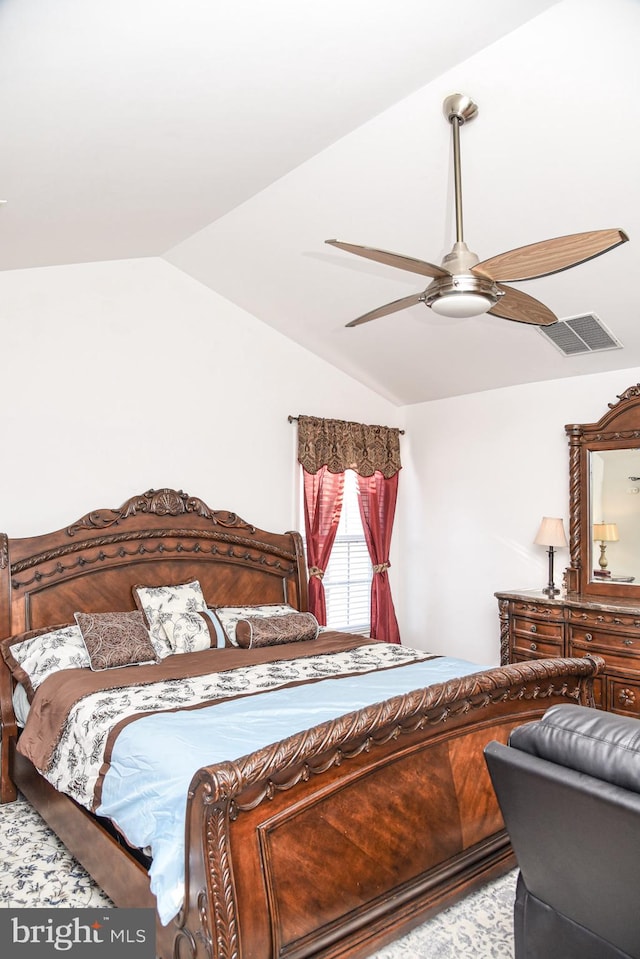 bedroom featuring lofted ceiling and ceiling fan