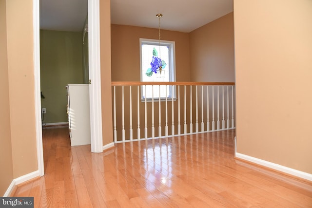 unfurnished room with hardwood / wood-style floors