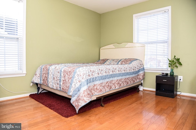 bedroom with hardwood / wood-style flooring