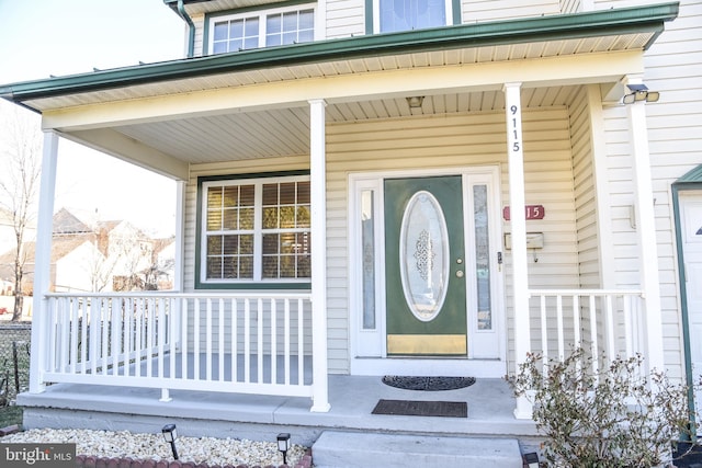 property entrance with covered porch