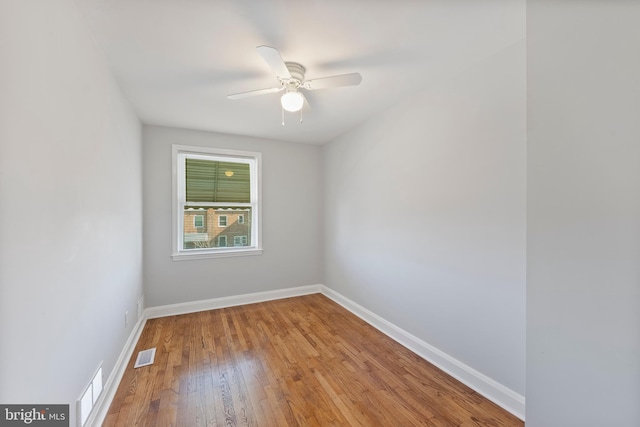 empty room with light hardwood / wood-style flooring and ceiling fan