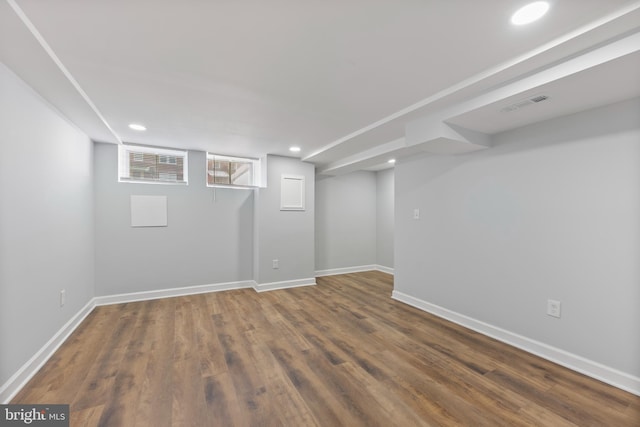 basement featuring dark hardwood / wood-style floors