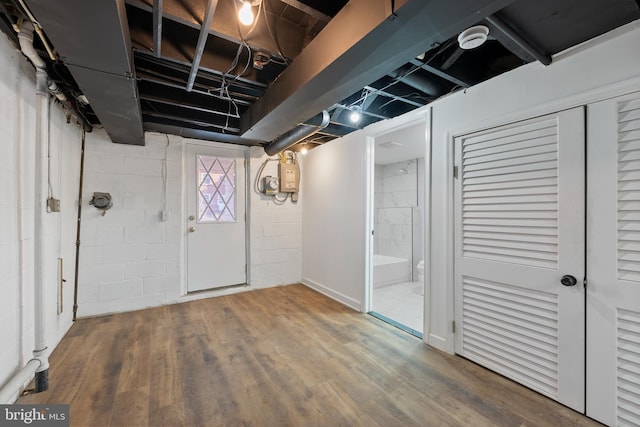 basement with wood-type flooring