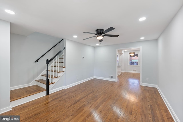 empty room featuring hardwood / wood-style flooring and ceiling fan