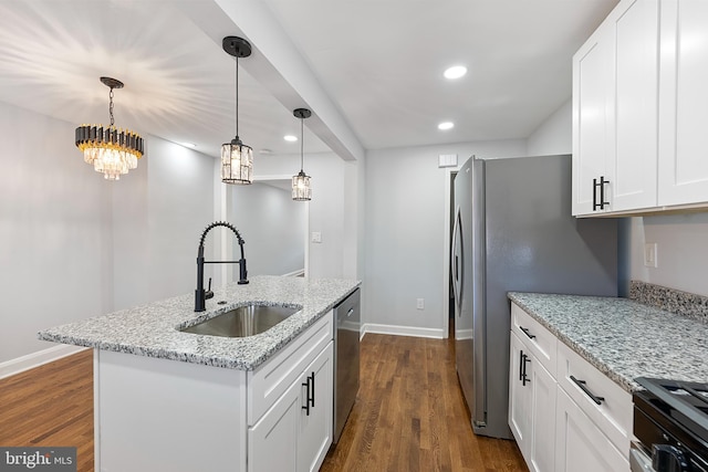 kitchen with white cabinetry, dishwasher, and sink