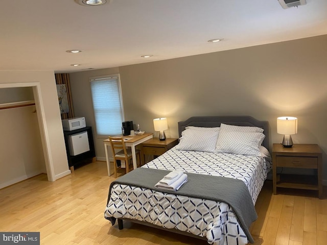 bedroom with light hardwood / wood-style flooring