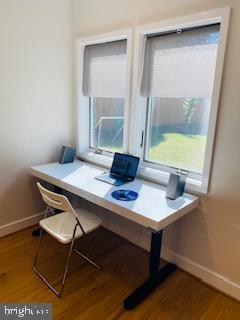 office area with wood-type flooring