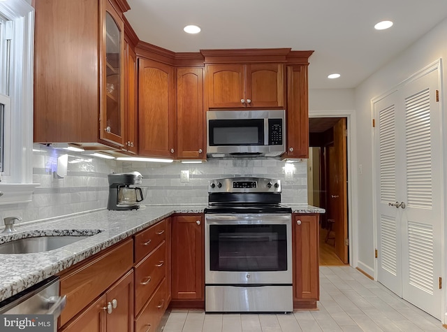 5425 Indian Head Hwy, Indian Head, MD 20640 - kitchen with stainless steel appliances, light stone countertops, and backsplash
