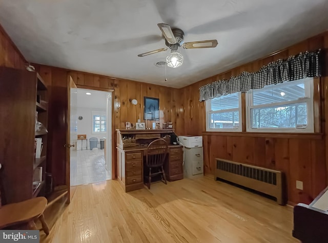 5425 Indian Head Hwy, Indian Head, MD 20640 - home office with ceiling fan, radiator, wooden walls, and light wood-type flooring