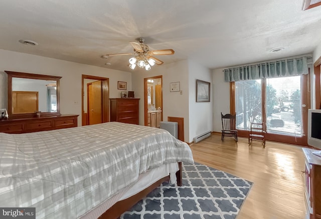 5425 Indian Head Hwy, Indian Head, MD 20640 - bedroom featuring a baseboard radiator and light hardwood / wood-style floors