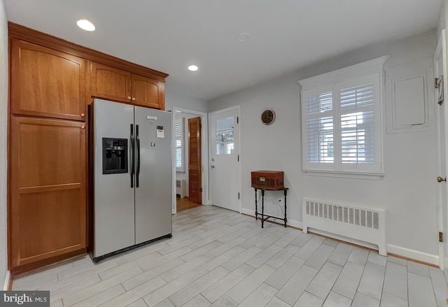 5425 Indian Head Hwy, Indian Head, MD 20640 - kitchen featuring radiator, light hardwood / wood-style flooring, and stainless steel fridge with ice dispenser