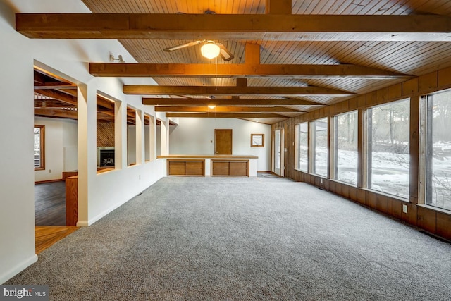 interior space with beam ceiling and ceiling fan