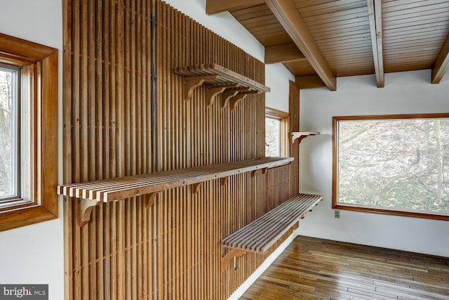 interior space featuring wood-type flooring and beamed ceiling