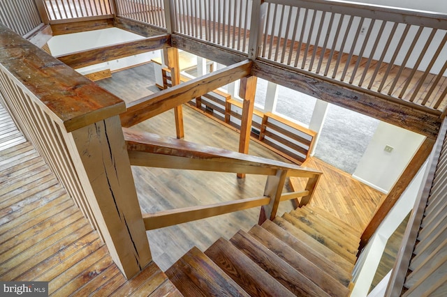 stairs with wood-type flooring