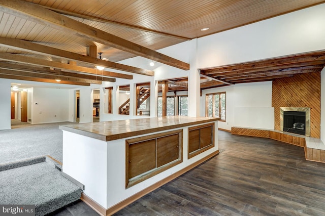 kitchen featuring wood ceiling, beam ceiling, and dark hardwood / wood-style floors