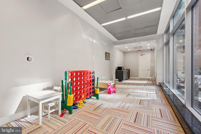 playroom featuring light colored carpet