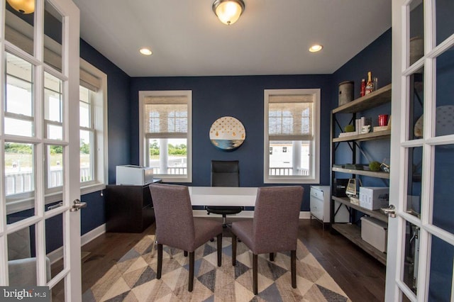 dining area with french doors and dark hardwood / wood-style floors