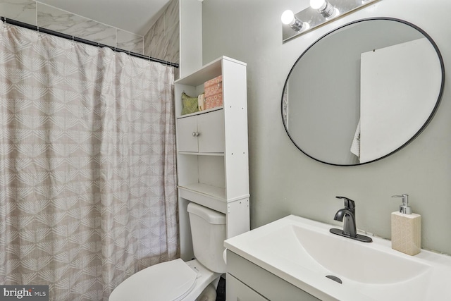 bathroom featuring vanity, a shower with shower curtain, and toilet