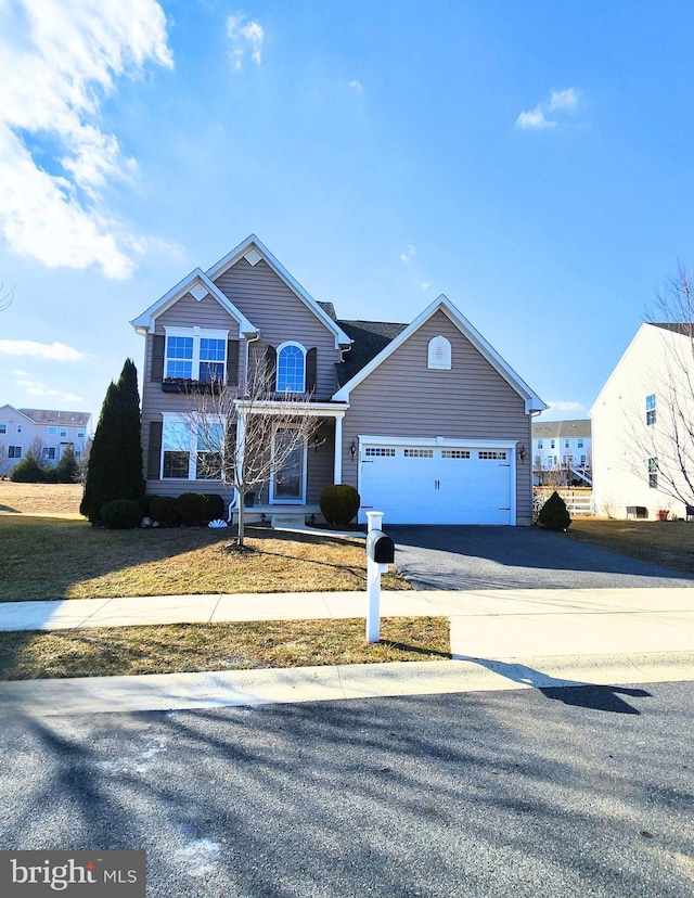 view of front of property featuring a pergola and a garage