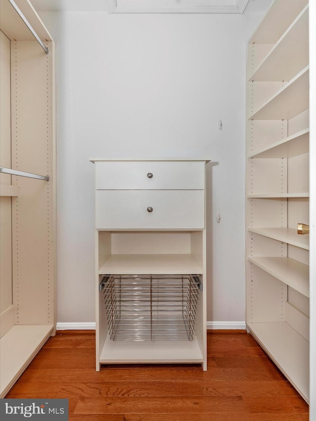 walk in closet featuring hardwood / wood-style floors