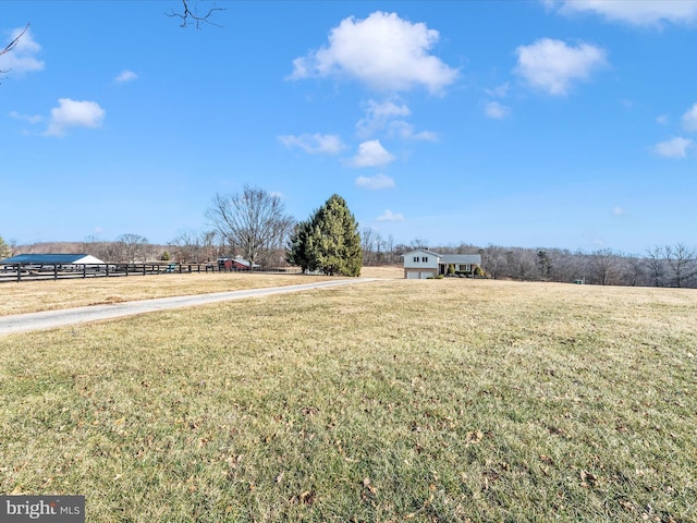 view of yard with a rural view