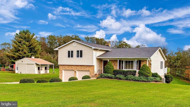 tri-level home featuring a front yard and a garage