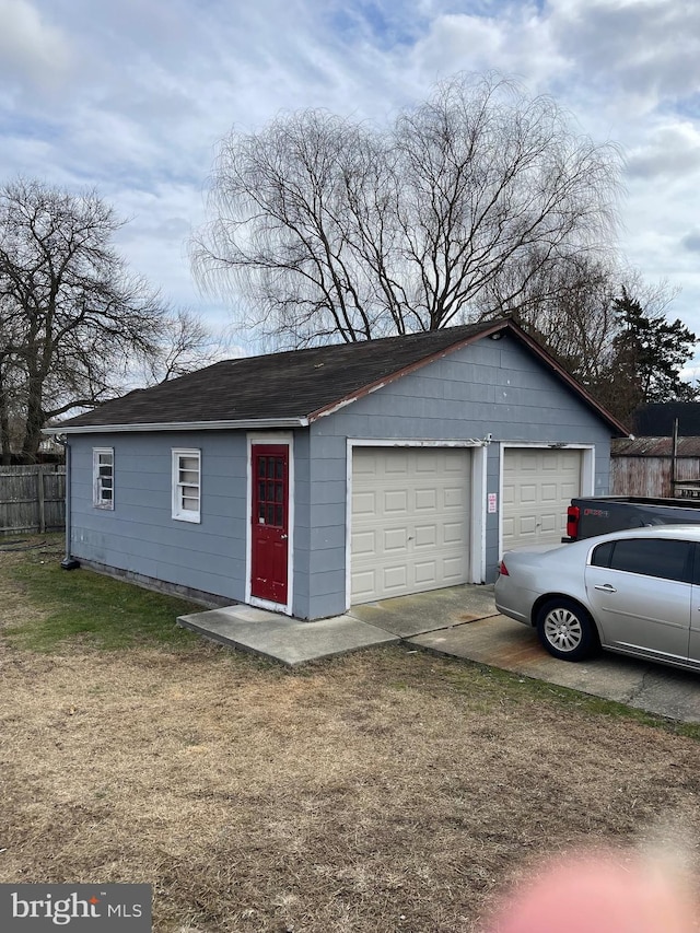 view of front of home with a garage and a front yard