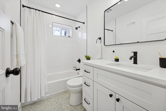 full bathroom with vanity, toilet, and shower / tub combo with curtain