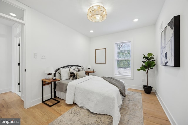 bedroom with hardwood / wood-style floors