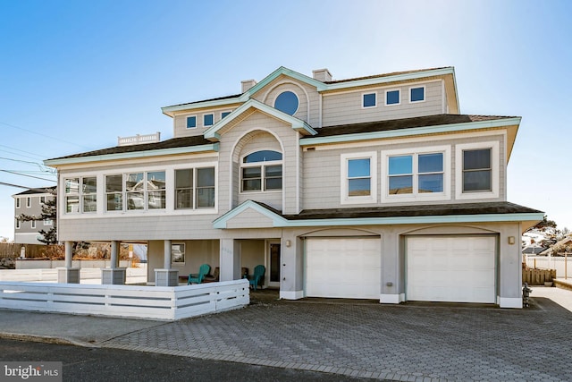 view of front of property with a garage