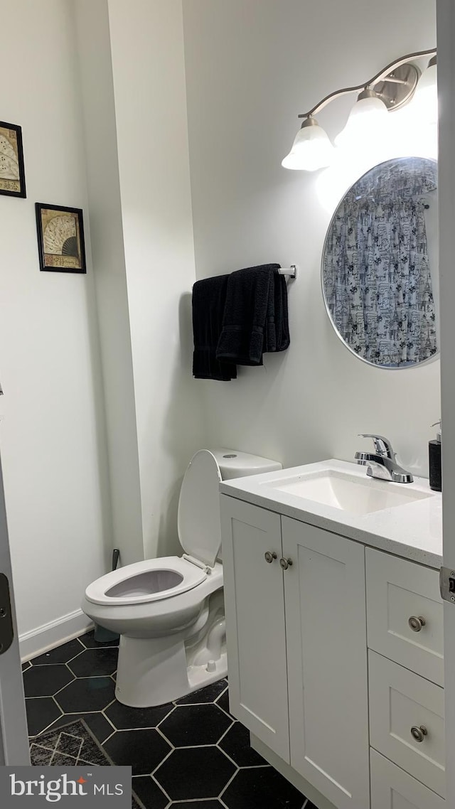 bathroom with vanity and toilet