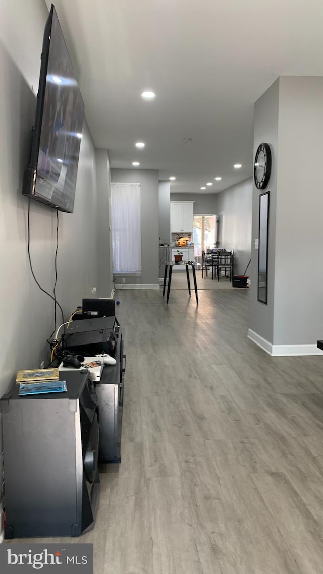 recreation room featuring light wood-type flooring