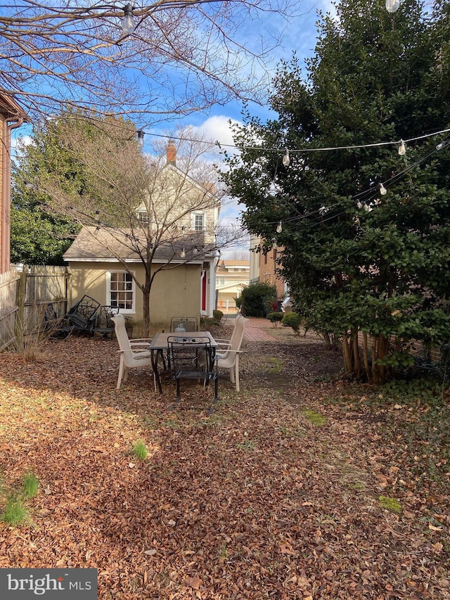 view of yard featuring an outdoor fire pit