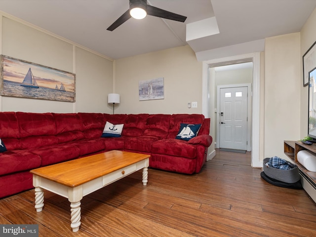 living room with hardwood / wood-style floors and ceiling fan