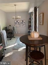 dining room with a notable chandelier