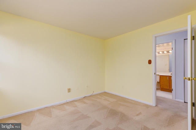 empty room featuring light colored carpet