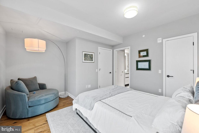 bedroom with light wood-type flooring