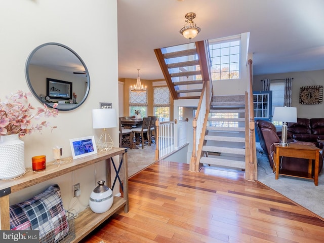 entryway featuring a chandelier and light wood-type flooring