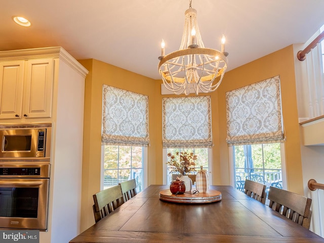 dining space featuring an inviting chandelier