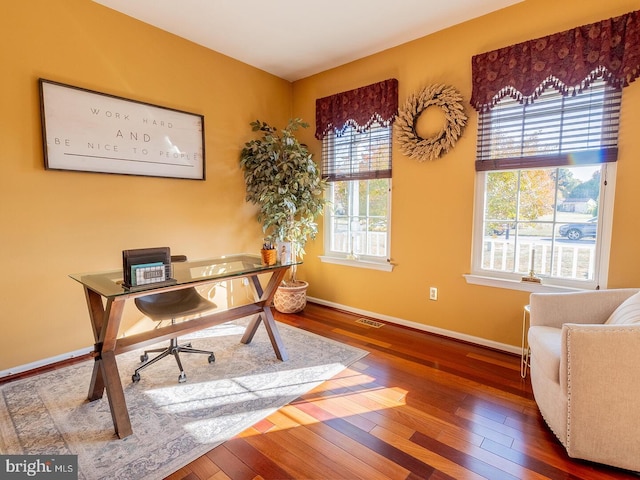 office with dark wood-type flooring