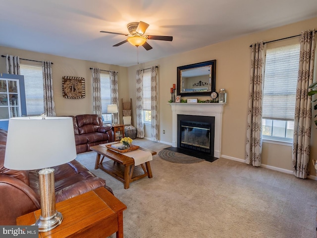 living room featuring light carpet, a wealth of natural light, and ceiling fan