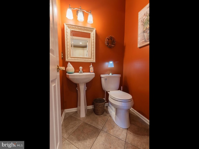 bathroom with tile patterned floors and toilet