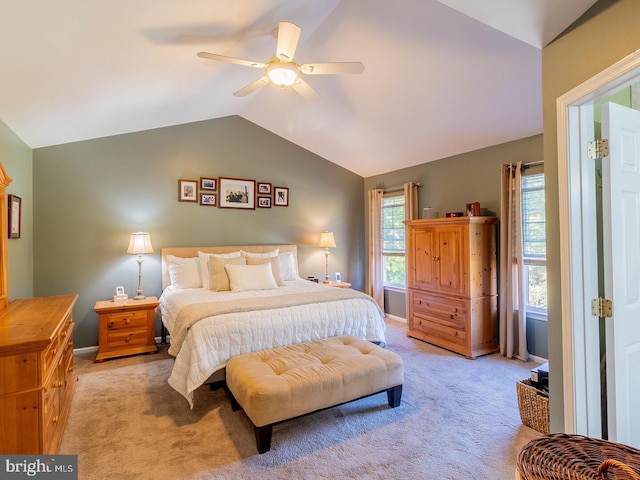 carpeted bedroom featuring vaulted ceiling and ceiling fan