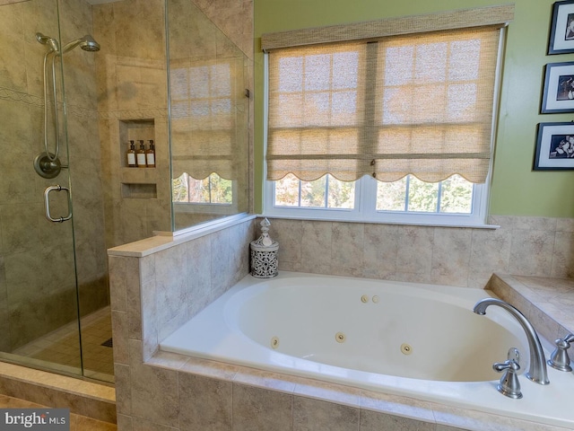 bathroom with separate shower and tub