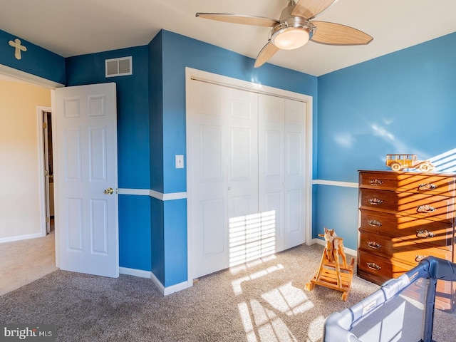 unfurnished bedroom featuring a closet, ceiling fan, and carpet flooring