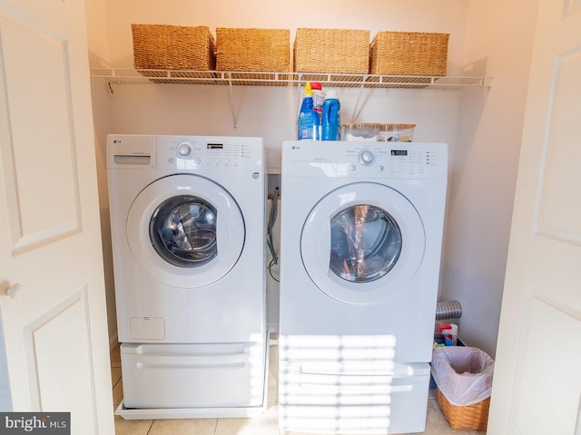 clothes washing area with washer and dryer