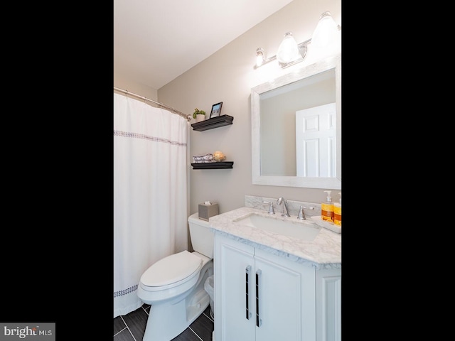 bathroom featuring vanity, toilet, and baseboard heating