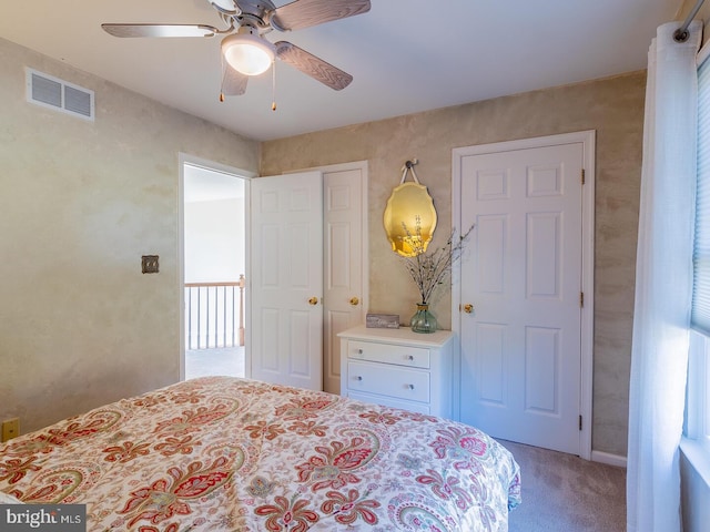 carpeted bedroom featuring ceiling fan