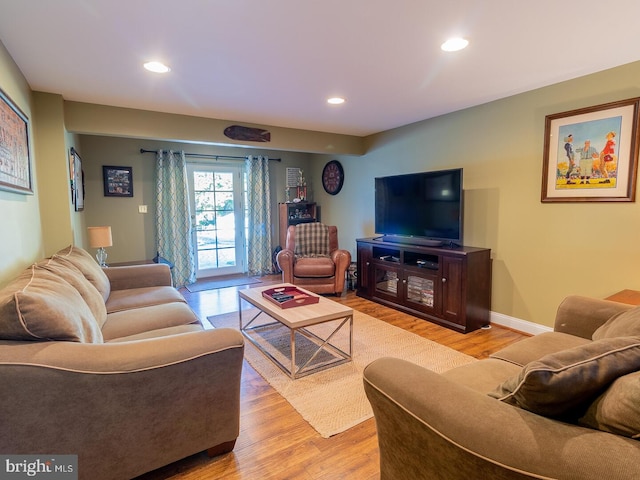 living room with light hardwood / wood-style flooring